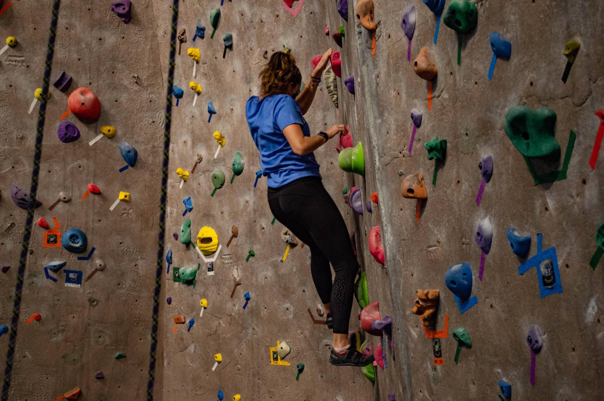 people bouldering at the climbing center